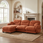 Seattle orange sectional sofa in a cozy living room with arched window and fireplace setting