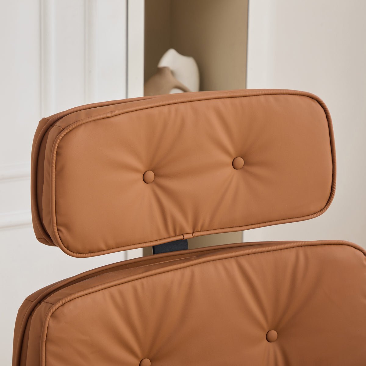 Selva brown office chair showing removable headrest detail