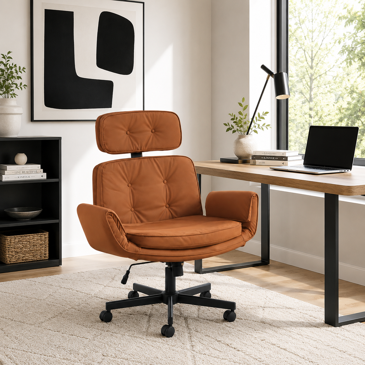 Selva brown office chair showing a wide seat and headrest beside a desk in a bright modern office