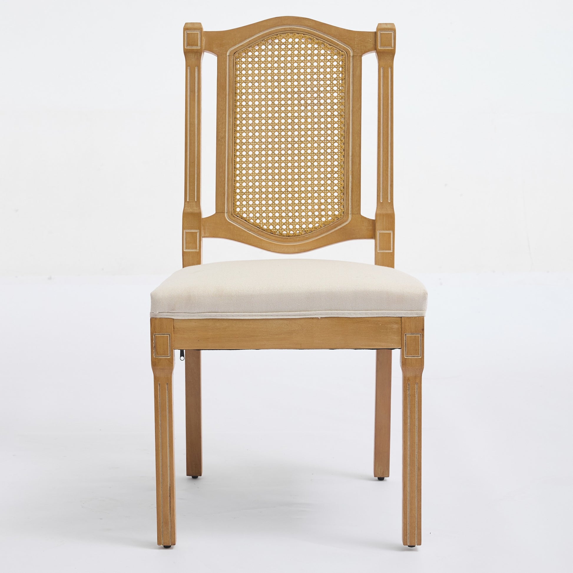 Shannon beige dining chair showing the front view with a woven cane back and linen seat