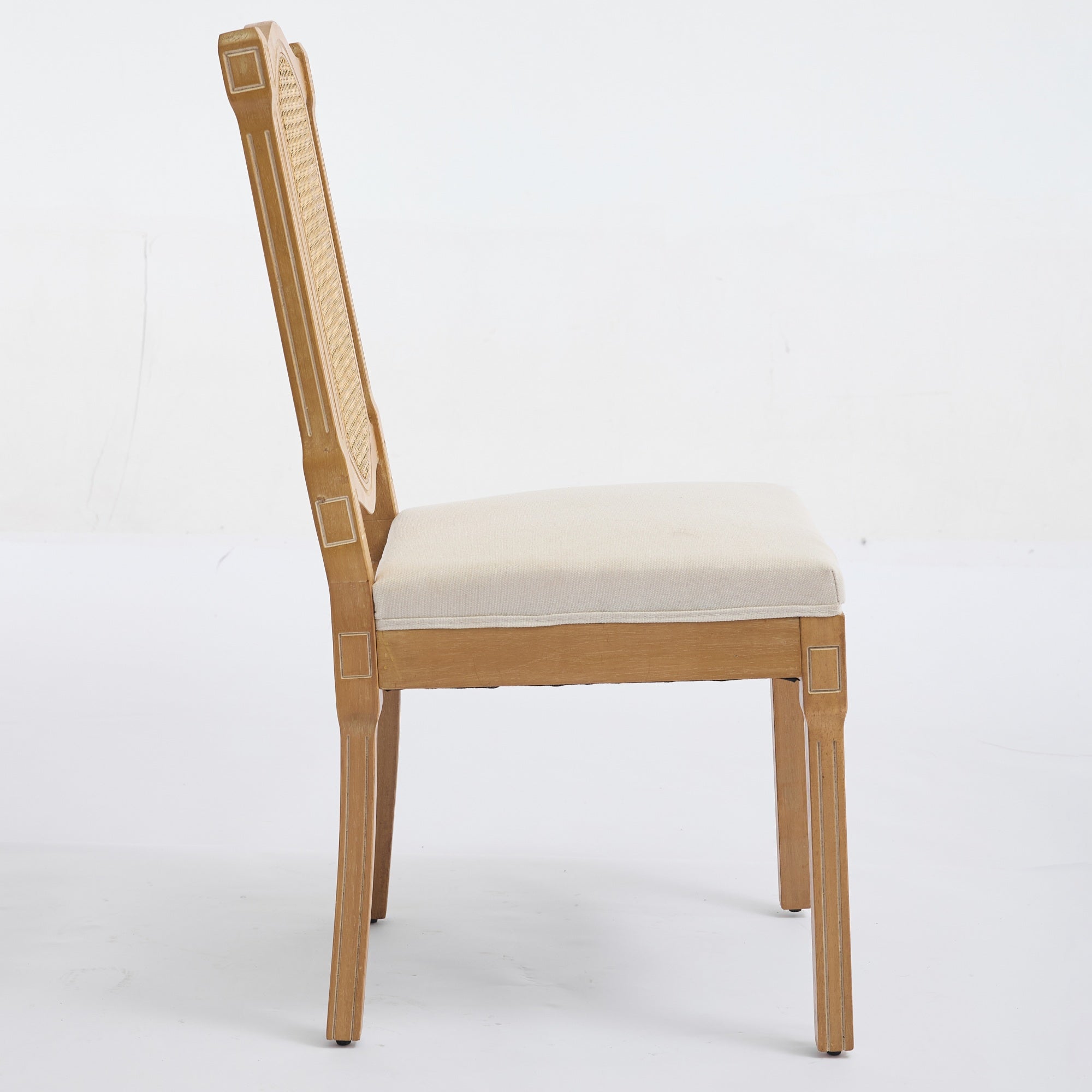 Shannon beige dining chair showing the side profile with a cane back and upholstered seat