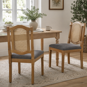 Shannon gray dining chairs showing a pair with cane backs beside a rectangular wood dining table