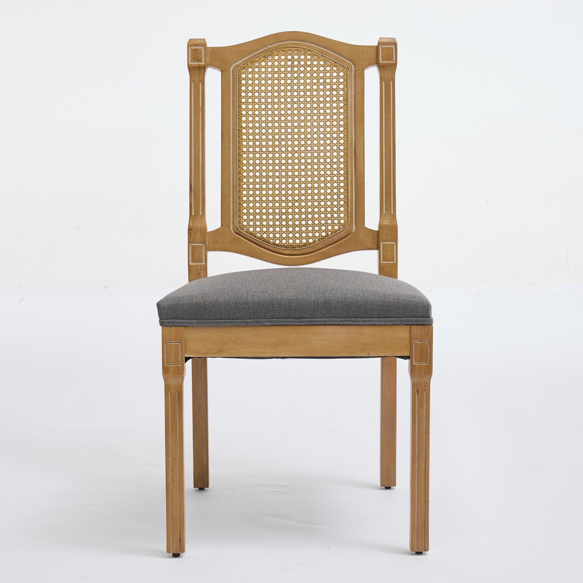 Shannon gray dining chair showing the front view with a woven cane back and linen seat