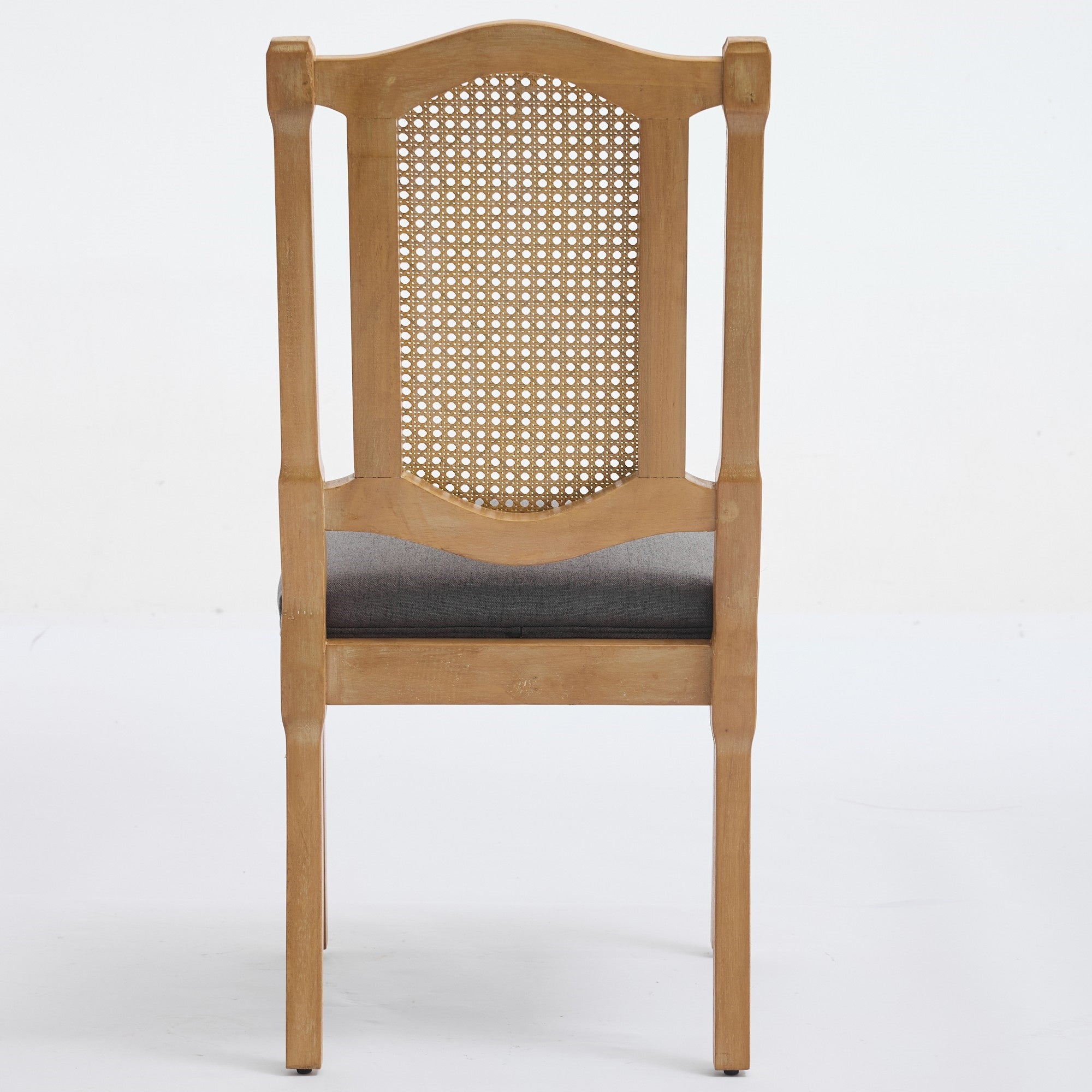 Shannon gray dining chair showing the full rear view with a woven cane back panel