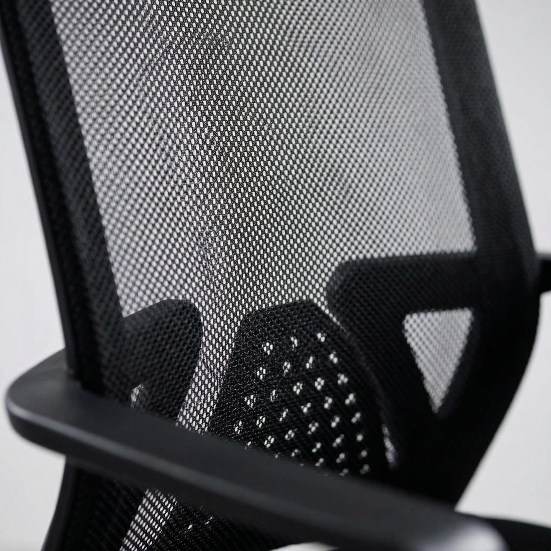 Skye black office chair showing breathable mesh back and lumbar support detail