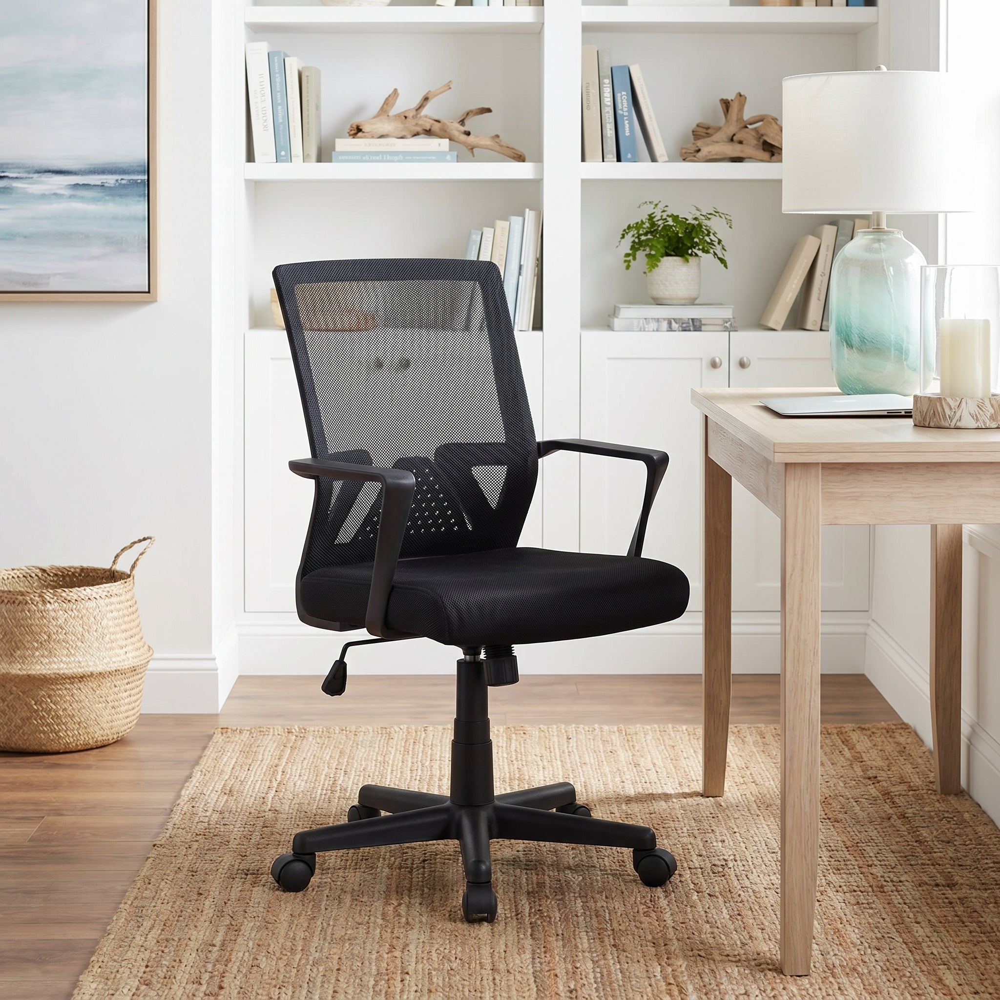 Skye black office chair showing a mid-back mesh chair in a bright home office