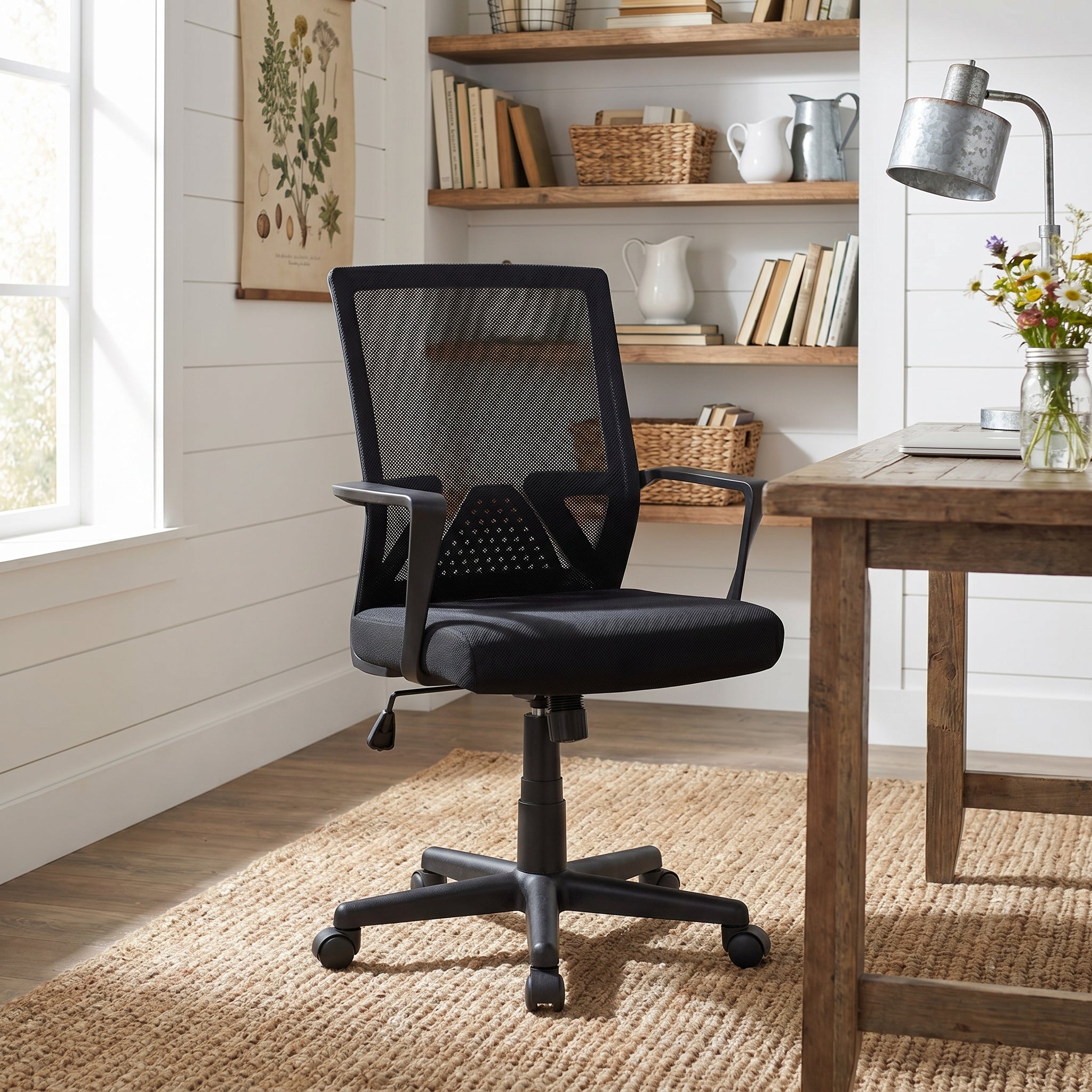 Skye black office chair showing a mesh task chair in a modern workspace