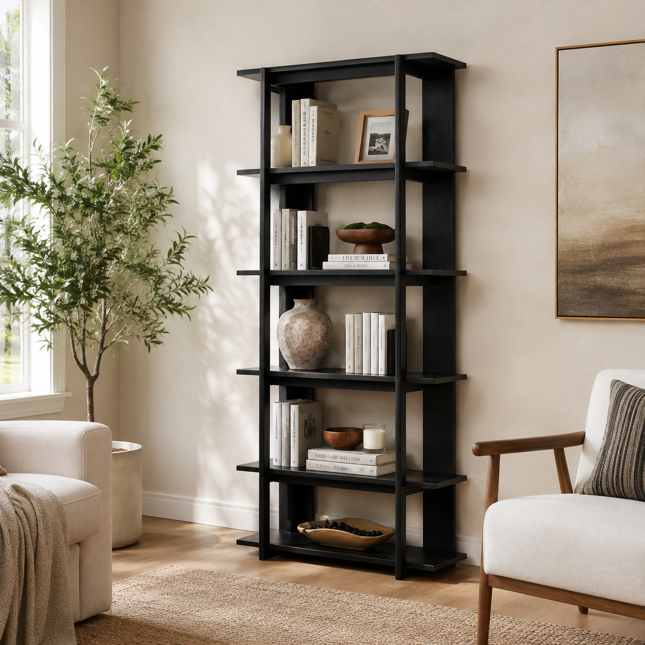 Sonnet black open bookcase showing vertical storage beside an armchair and indoor plant in a living room