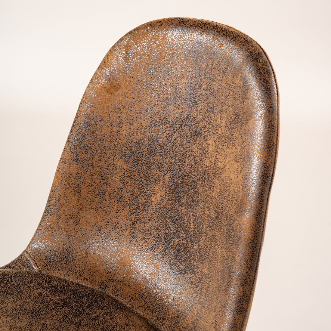 Sunflower suede brown dining chair showing curved backrest upholstery detail