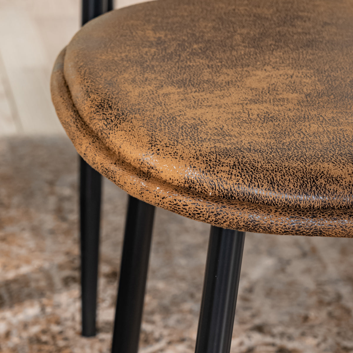 Sunflower suede brown dining chair showing round metal leg tip detail