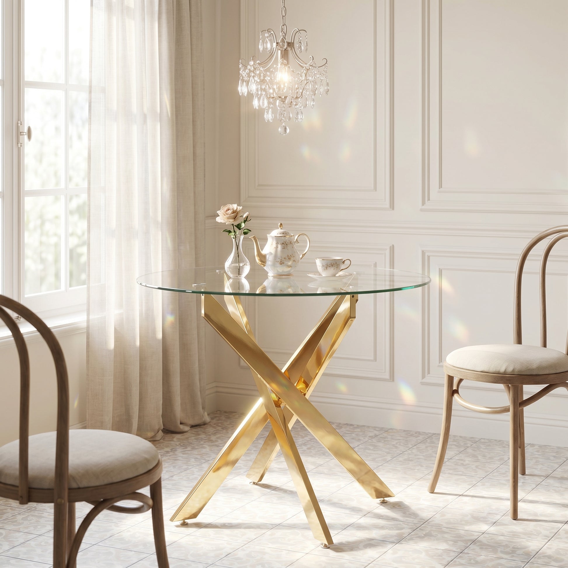 Tahiti gold dining table showing a glass tabletop with gold x-base in a bright interior