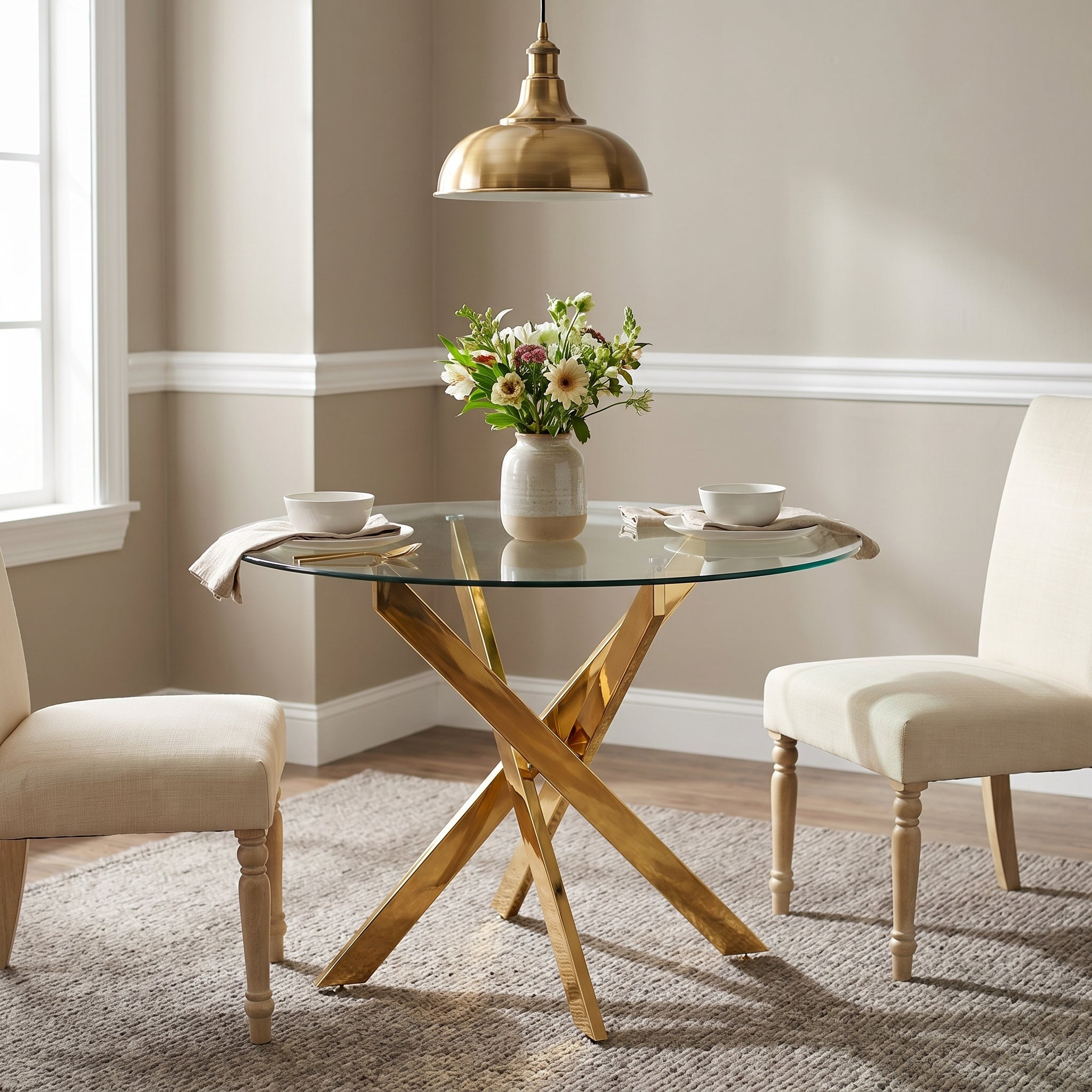 Tahiti gold dining table showing a round dining table with upholstered chairs