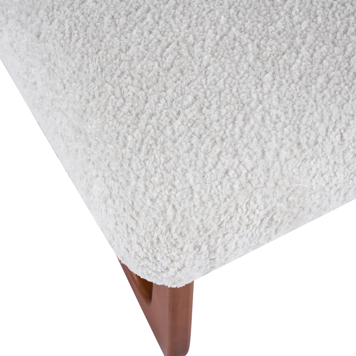 Tekapo white dining chair close-up of the boucle seat corner and wood base connection