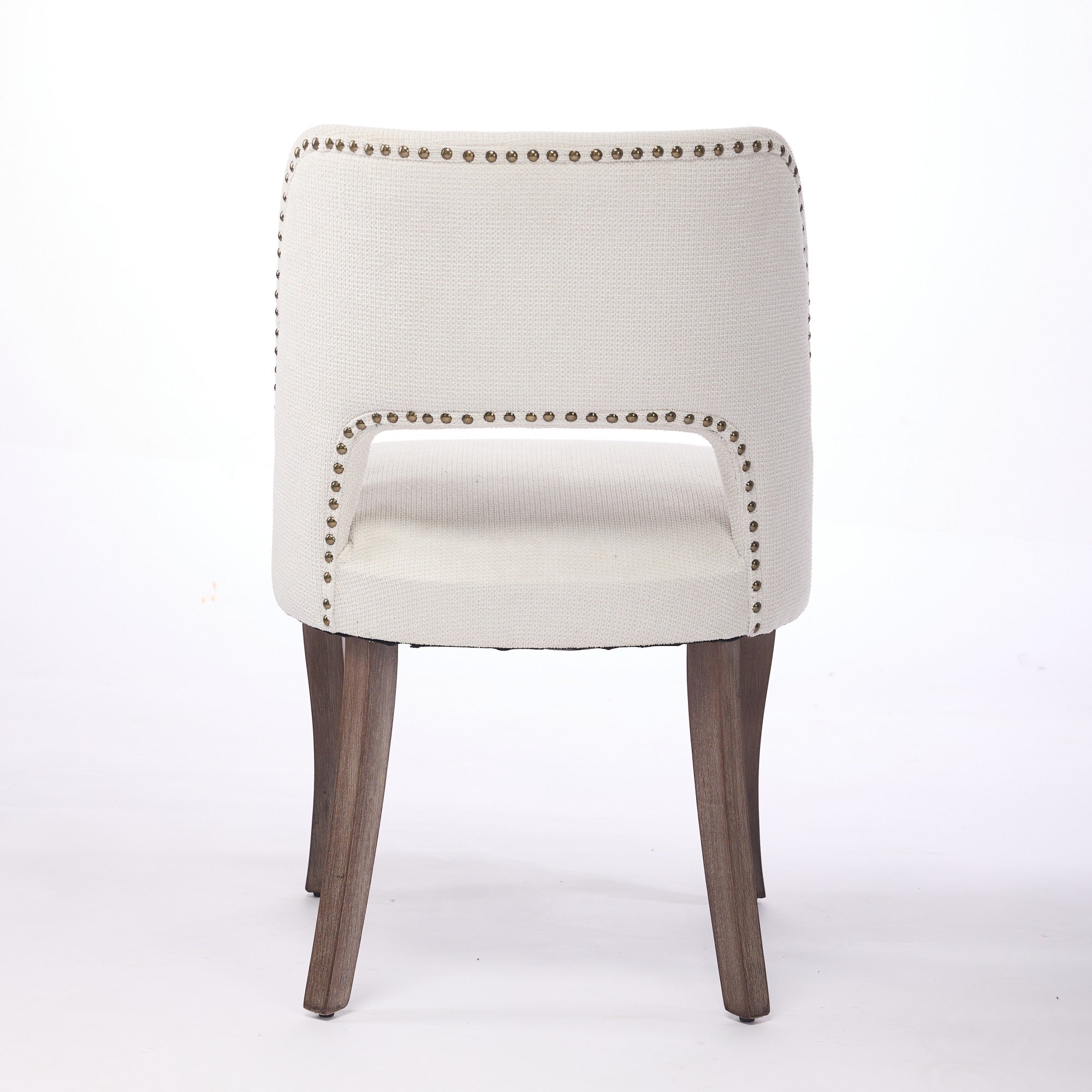 Tiberis beige dining chair showing the full rear view with an open cut-out back design