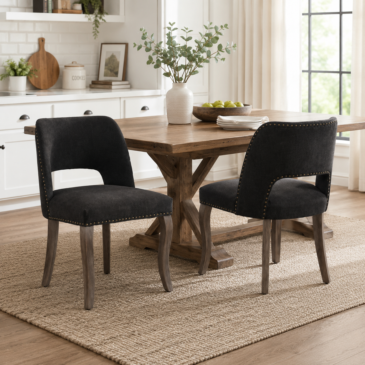 Tiberis black dining chairs showing four chairs around a wood table in a bright dining room
