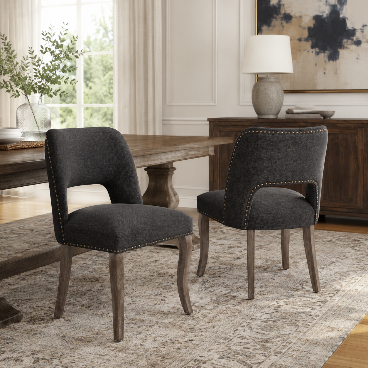 Tiberis black dining chairs showing a pair beside a wood dining table near tall windows