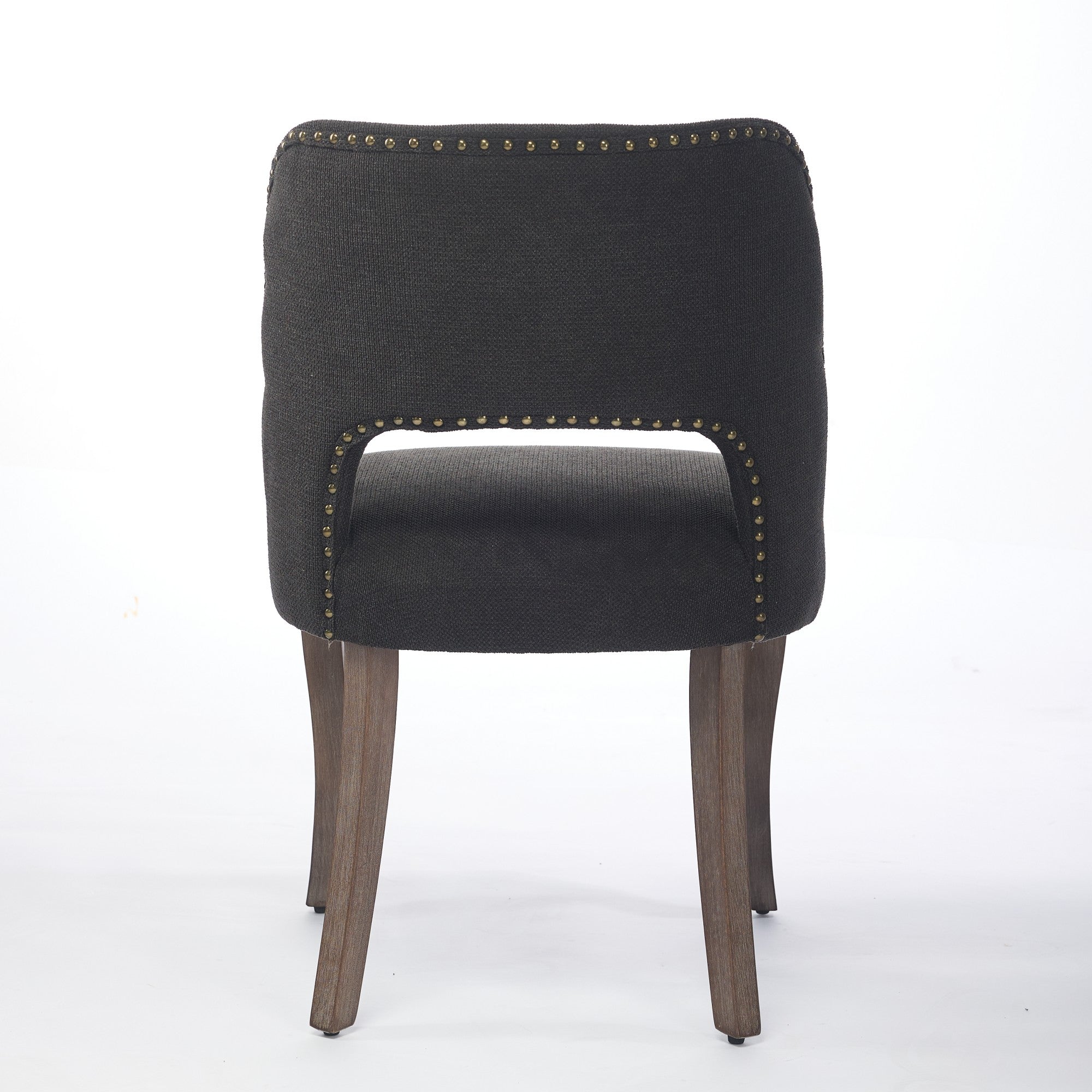 Tiberis black dining chair showing the full rear view with an open cut-out back and wood legs
