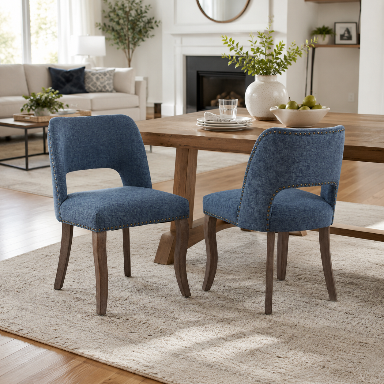 Tiberis blue dining chairs showing four chairs around a wood table in an open dining space