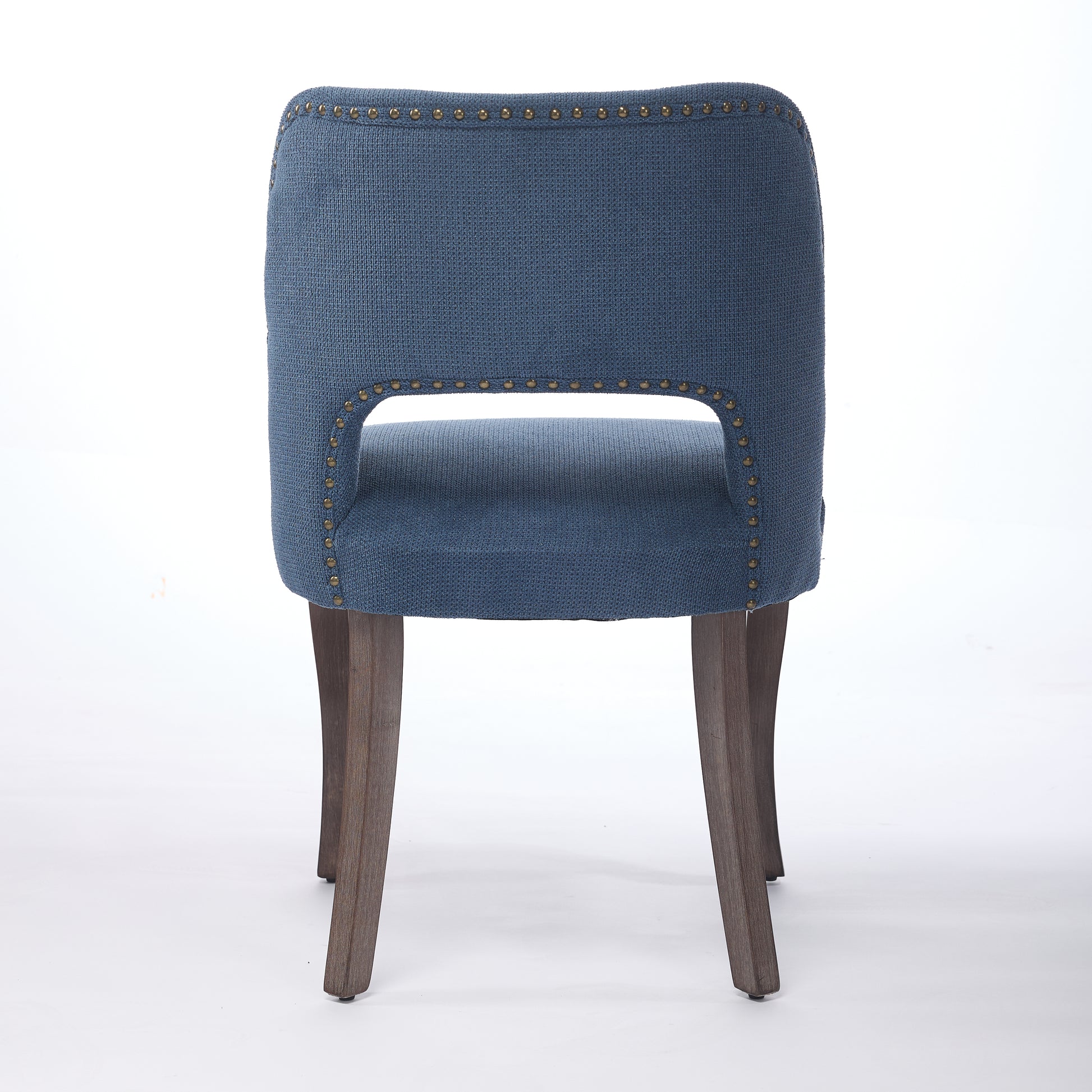 Tiberis blue dining chair showing the full rear view with an open cut-out back and wood legs