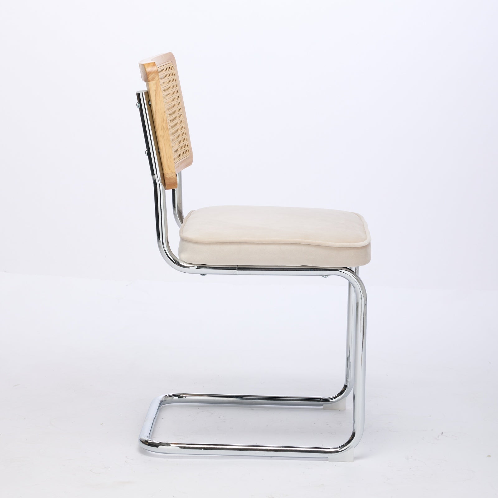 Tigris beige velvet cantilever dining chair side view on white background