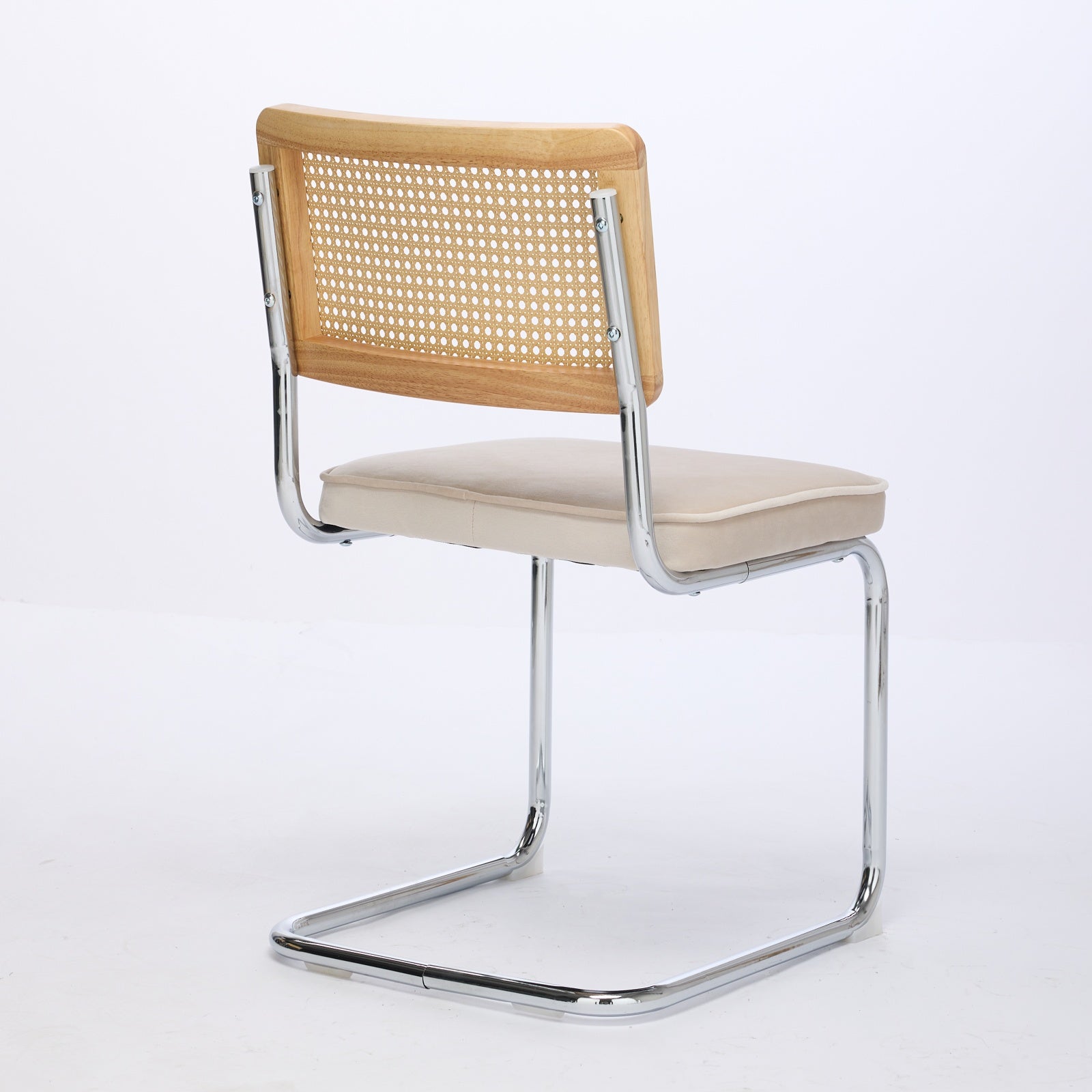 Tigris beige dining chair rear view showing the handwoven cane backrest on white background