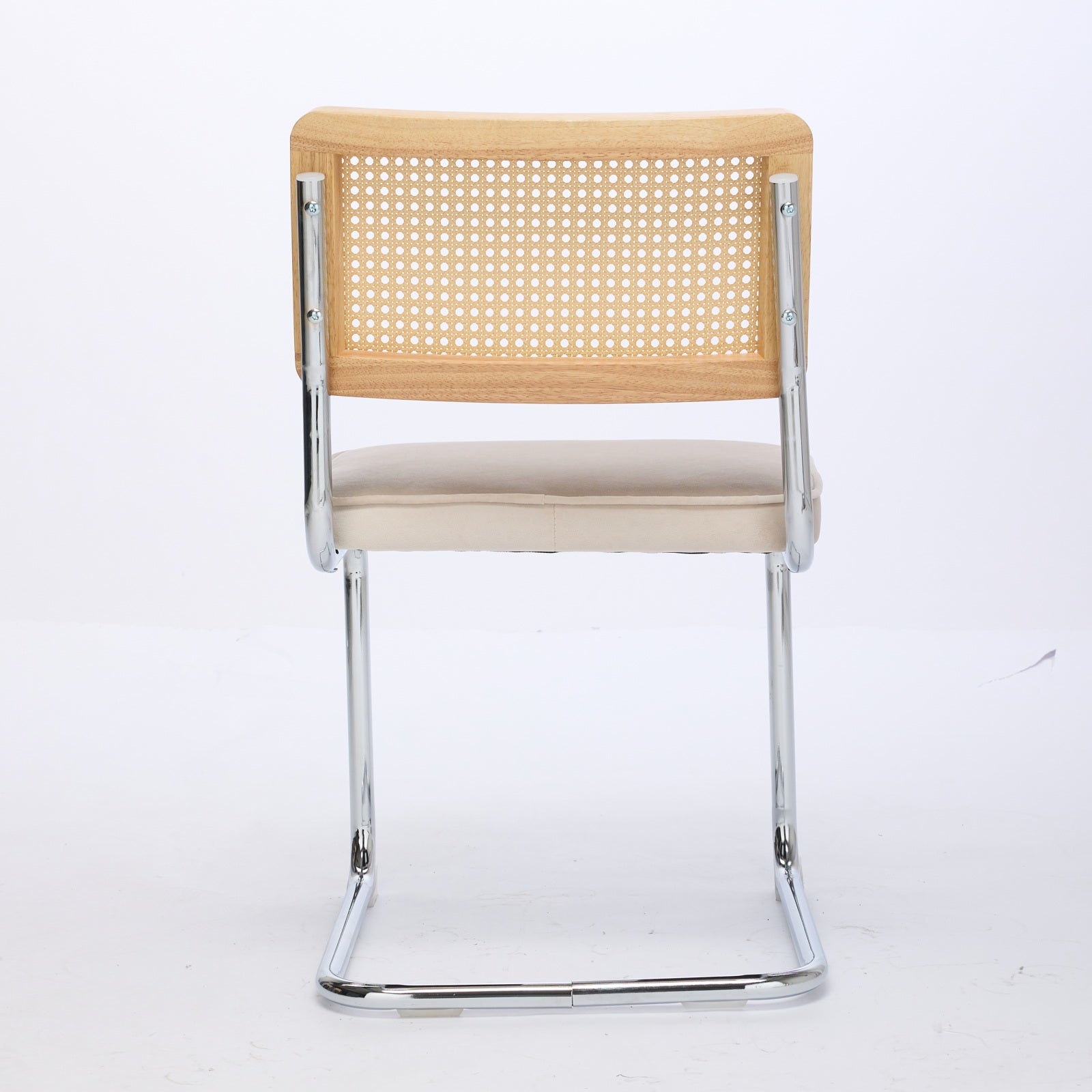 Tigris beige dining chair rear view showing the handwoven cane backrest on white background