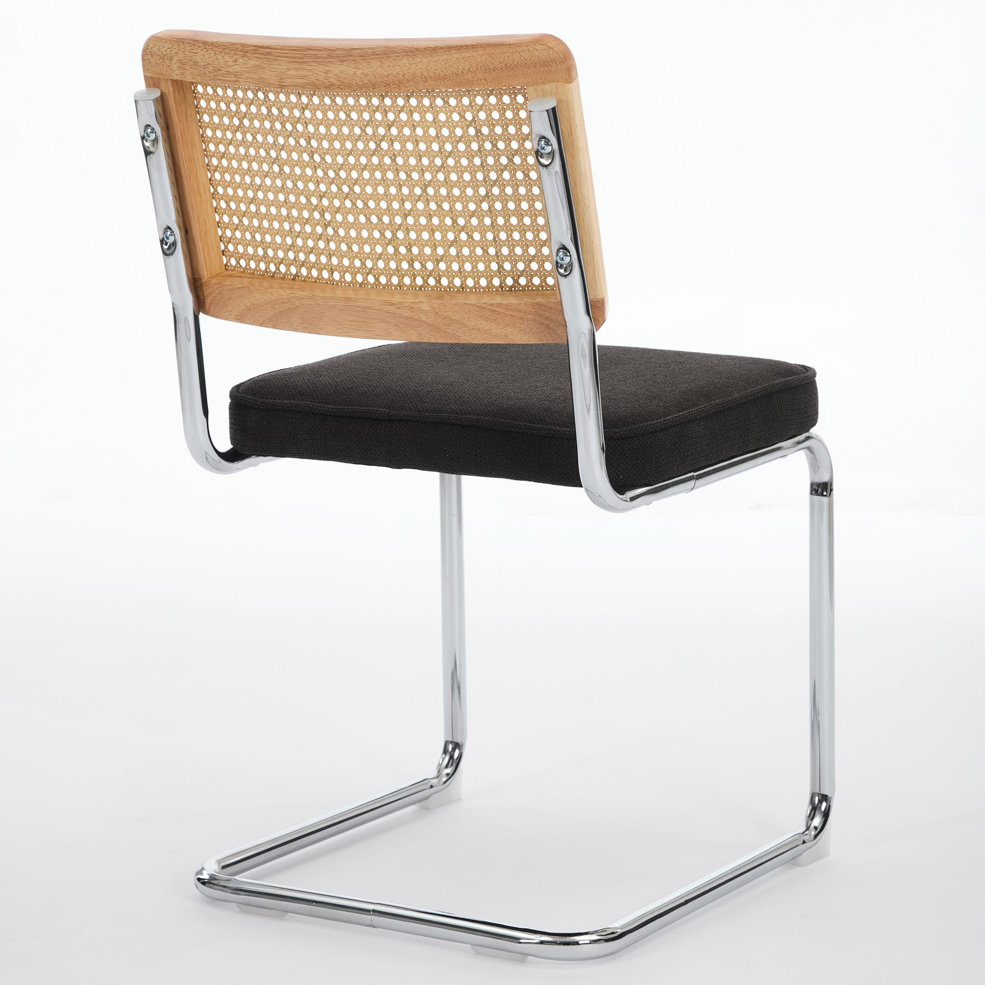 Tigris black dining chair rear view with handwoven cane backrest on white background