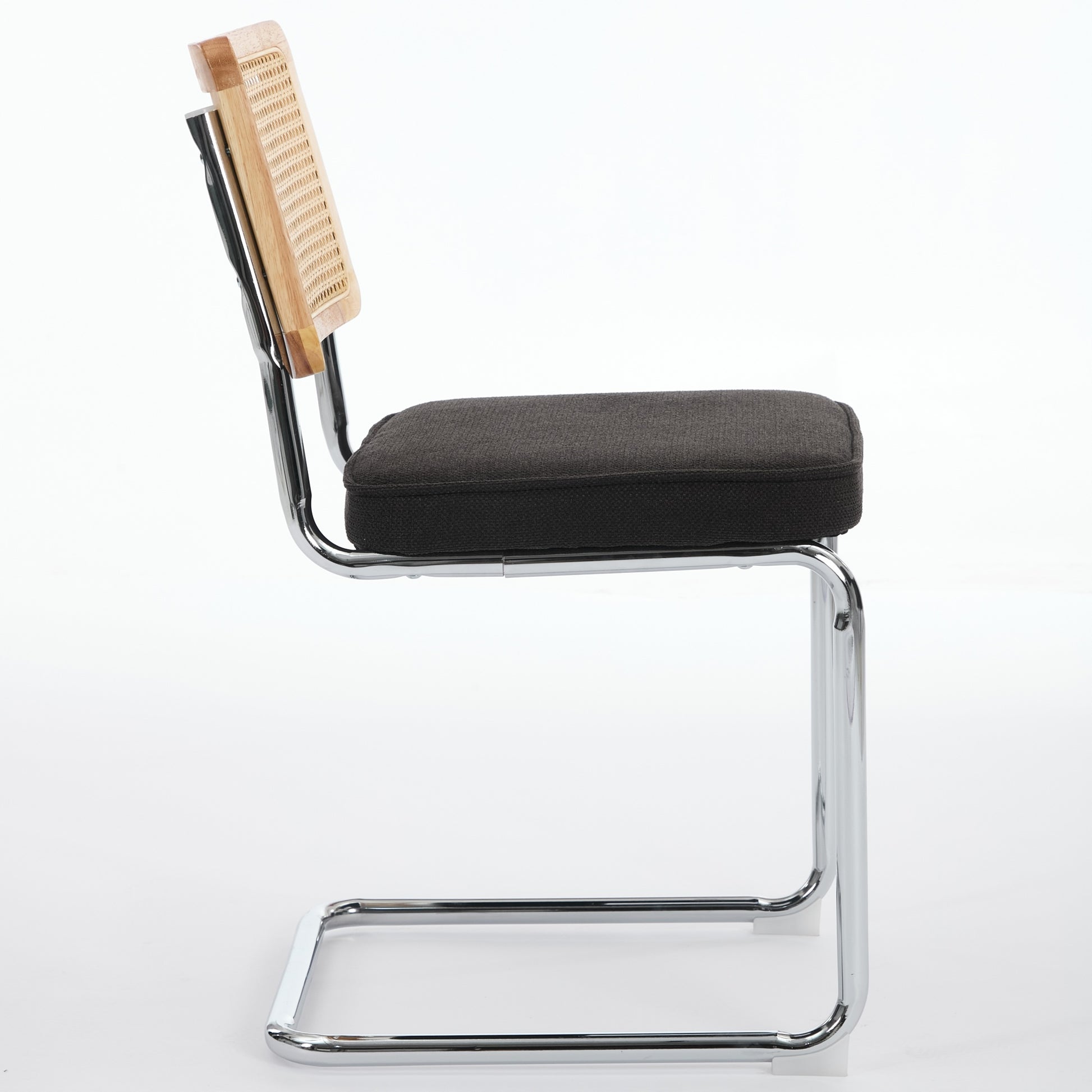 Tigris black velvet cantilever dining chair side view on white background
