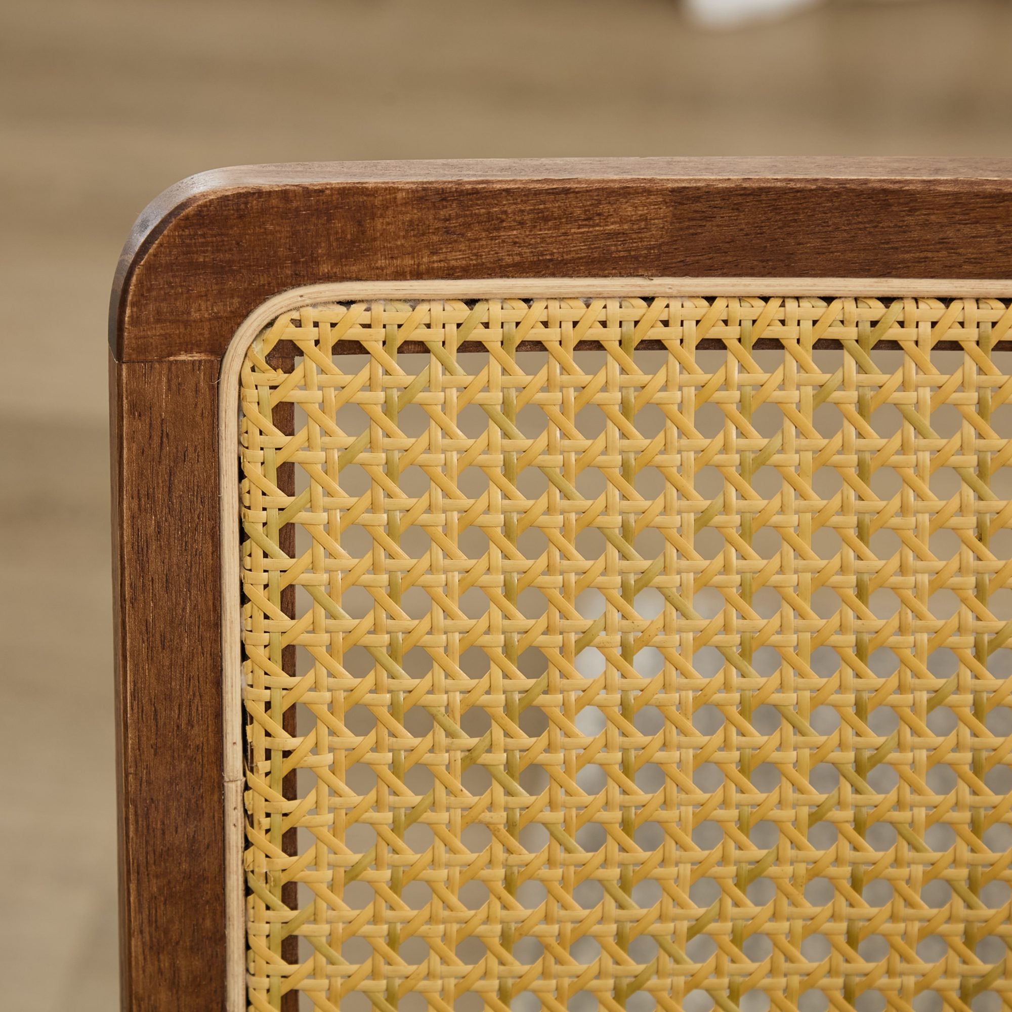 Tigris brown dining chair close-up of the handwoven cane back panel