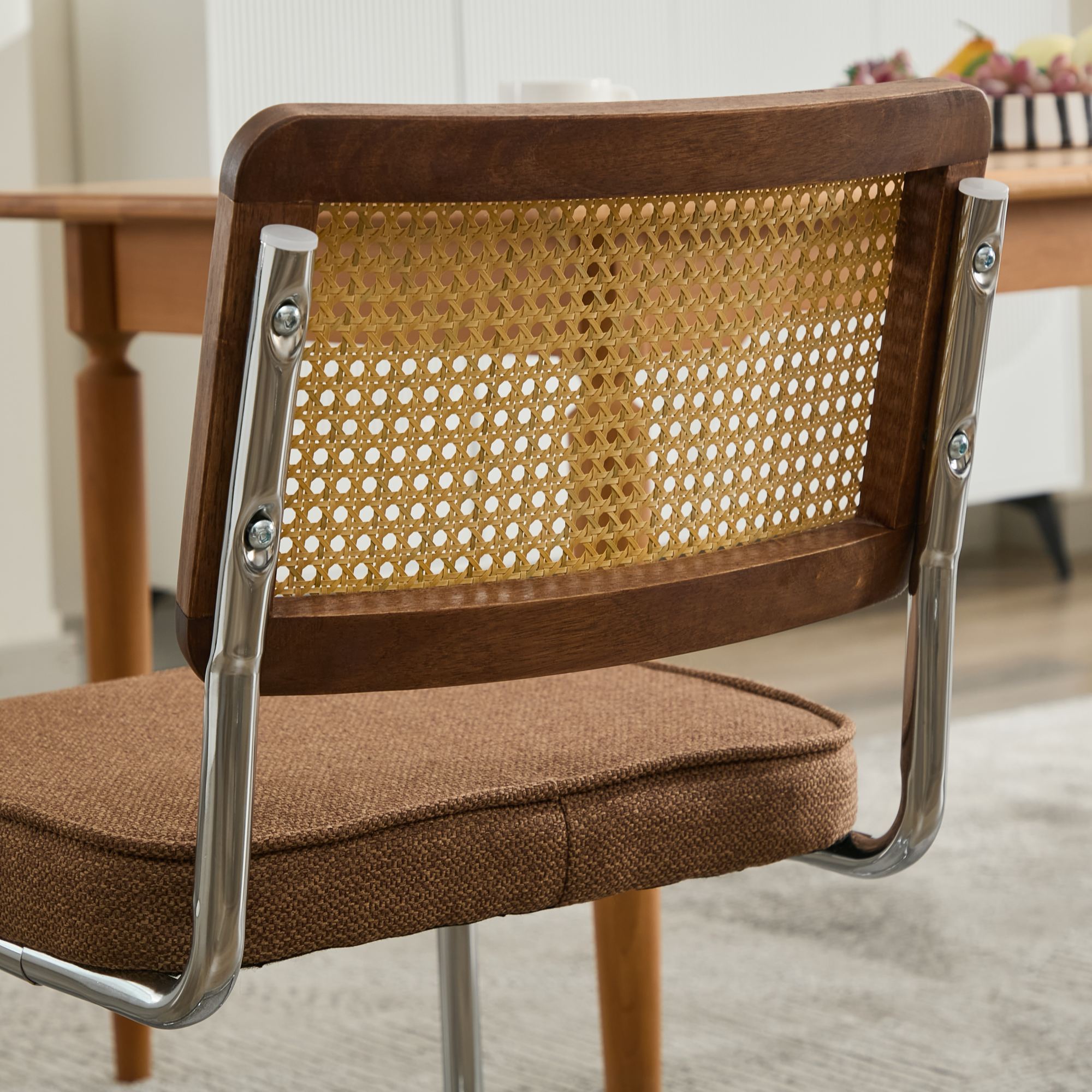 Tigris brown dining chair close-up of the velvet seat and chrome base