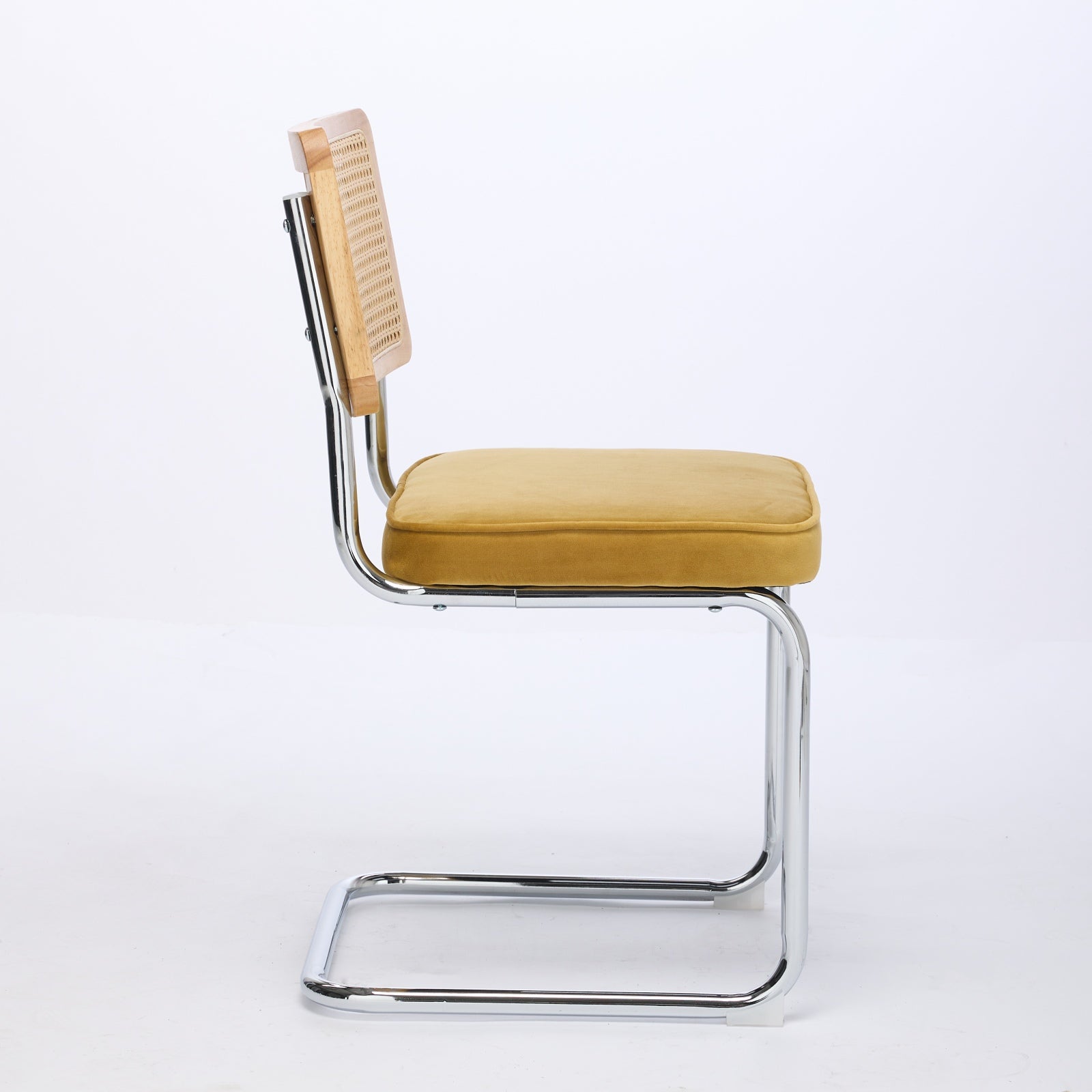 Tigris yellow velvet cantilever dining chair side view on white background