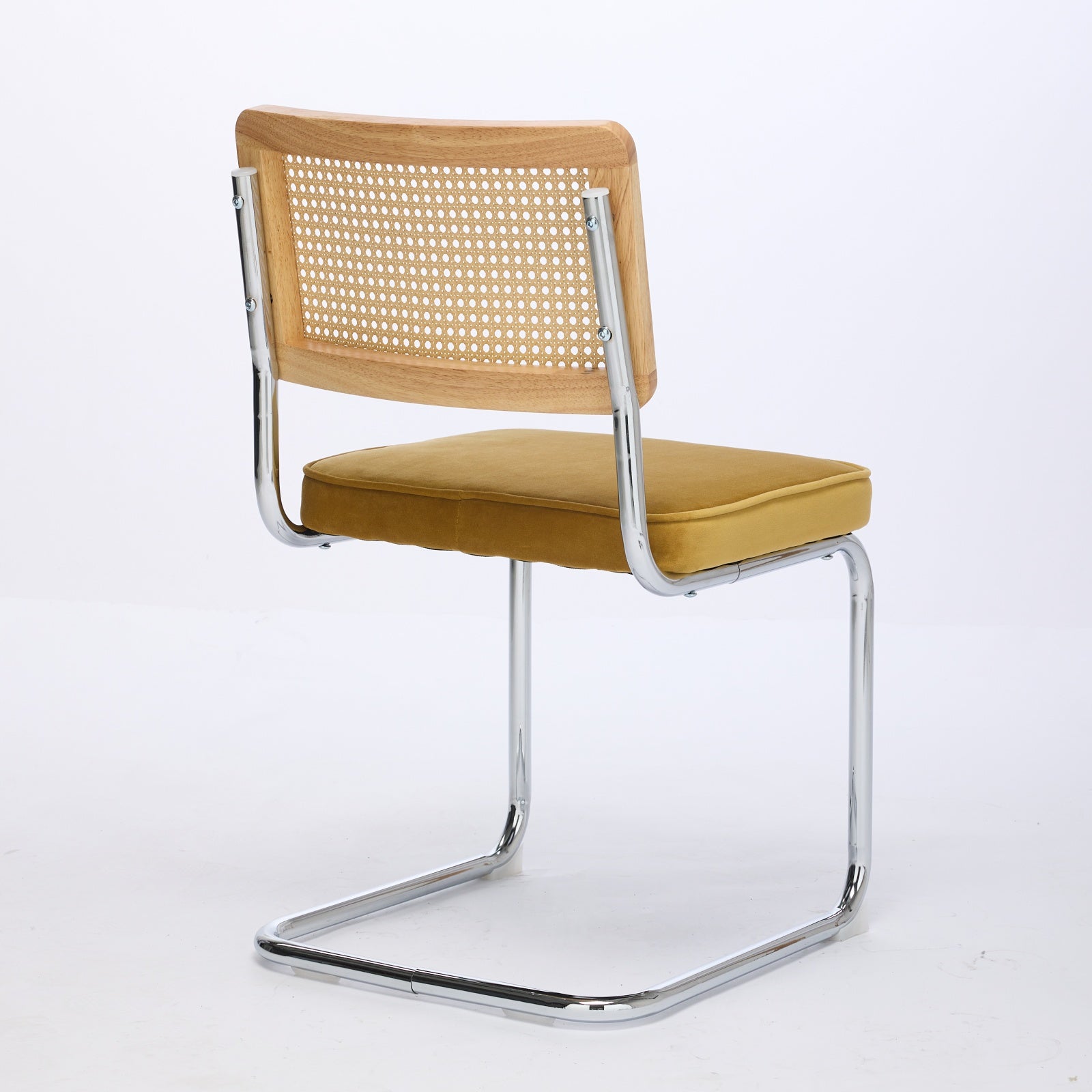 Tigris yellow dining chair front angled view with handwoven cane back on white background