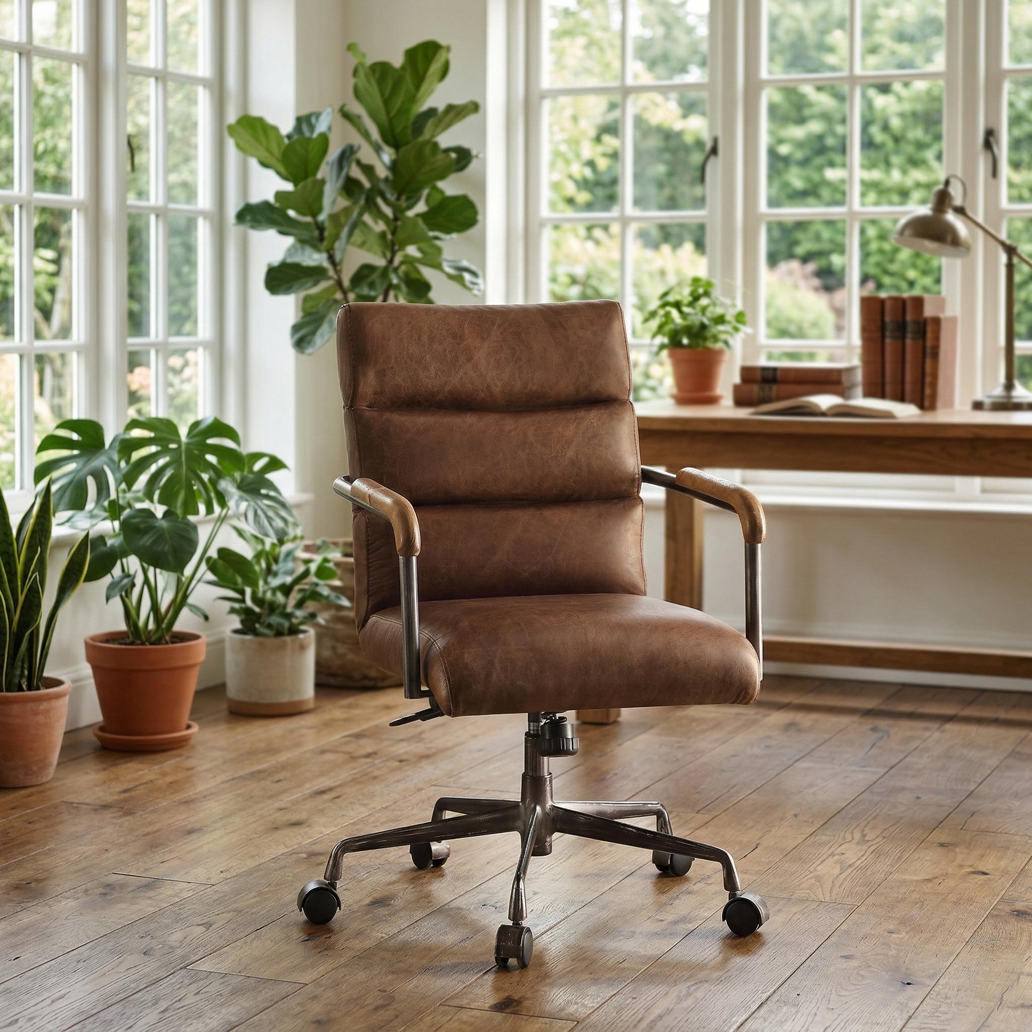 Torin brown genuine leather office chair at a wooden desk in a cozy home office