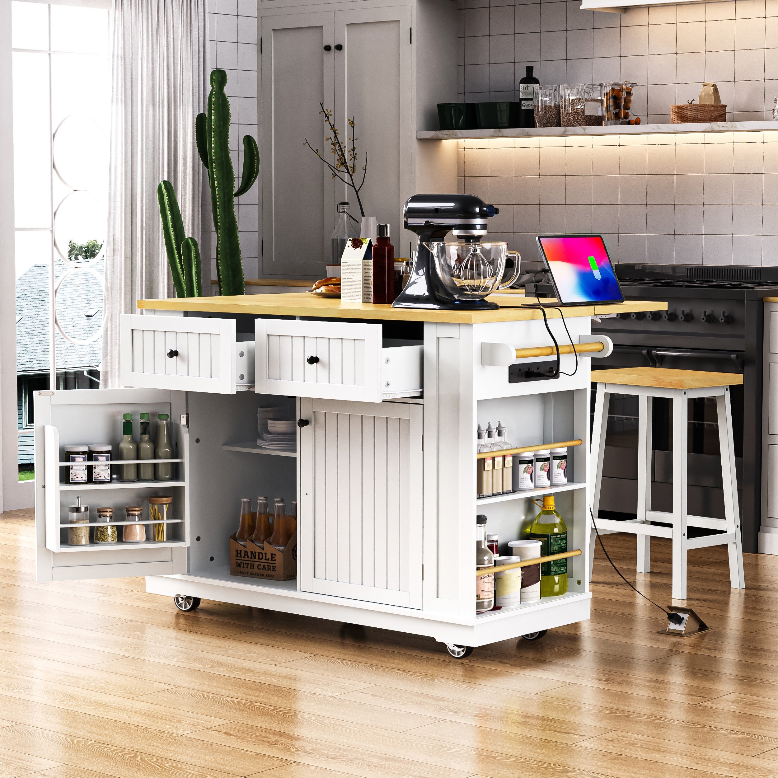 Toulouse 48 inch white rolling kitchen island with open drawers cabinet storage side spice racks built in power outlet and mobile kitchen workspace scene