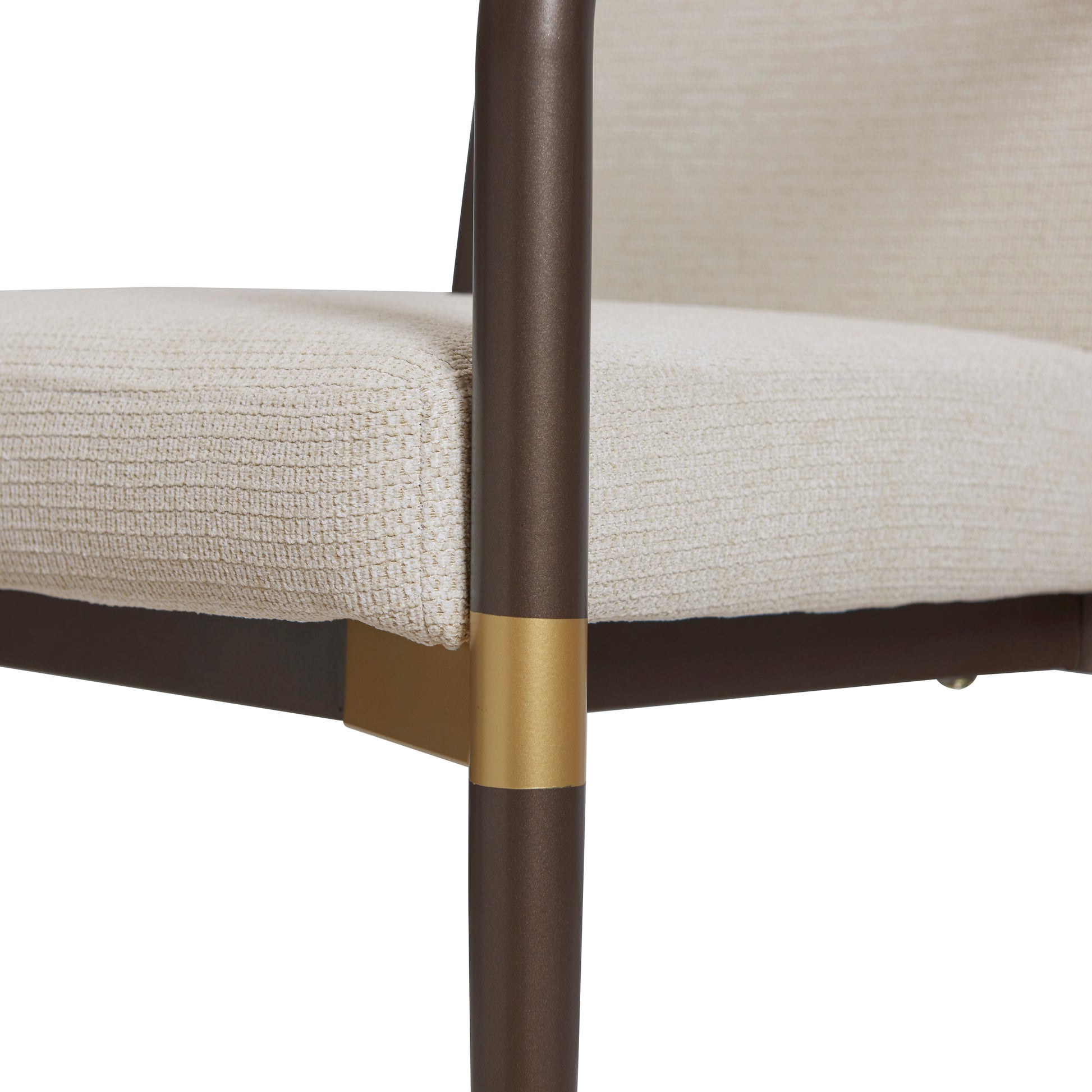 Trasimeno brown dining armchair close-up of the brass-tone accent on the front leg