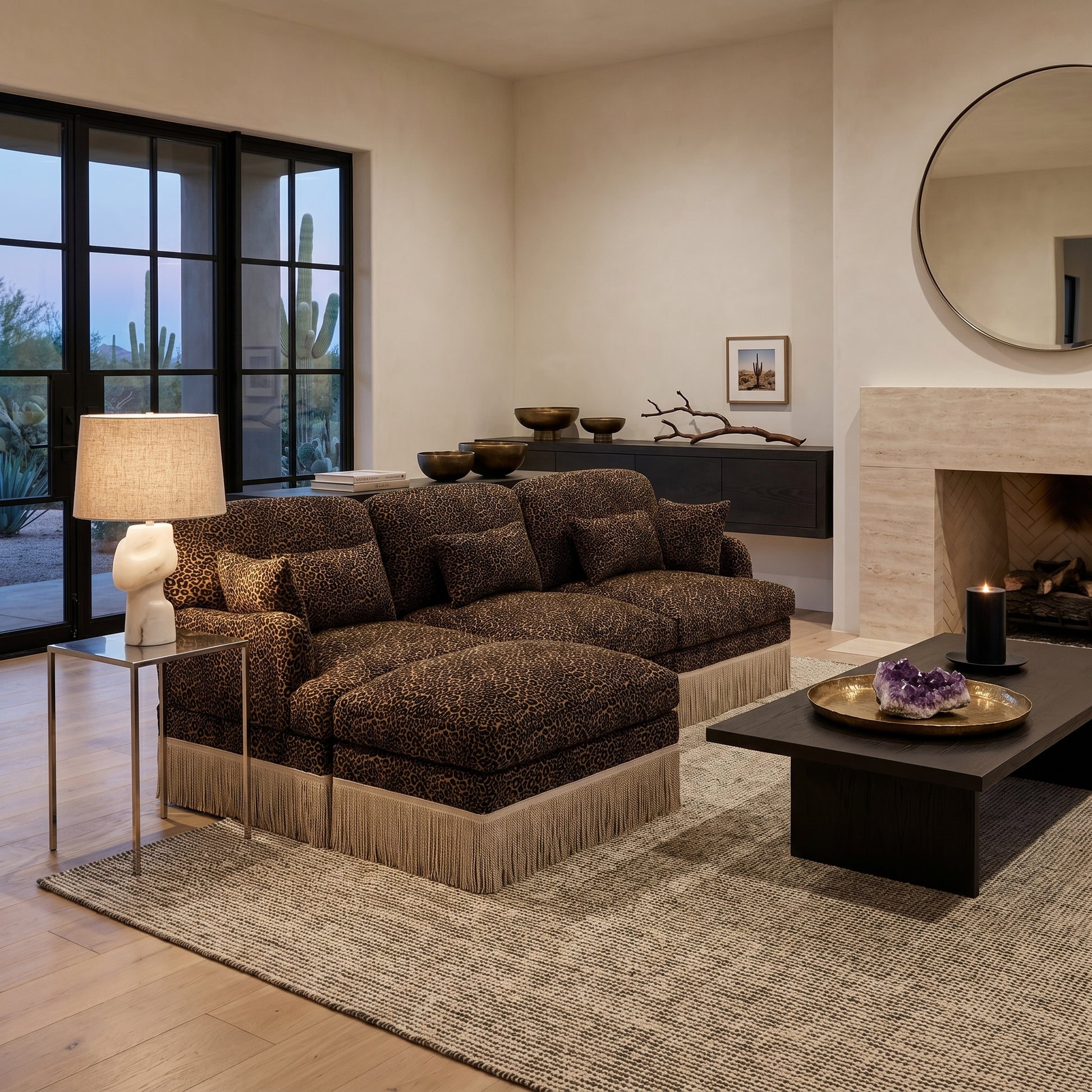 Tucson brown leopard print chenille sectional sofa with fringe trim beside fireplace