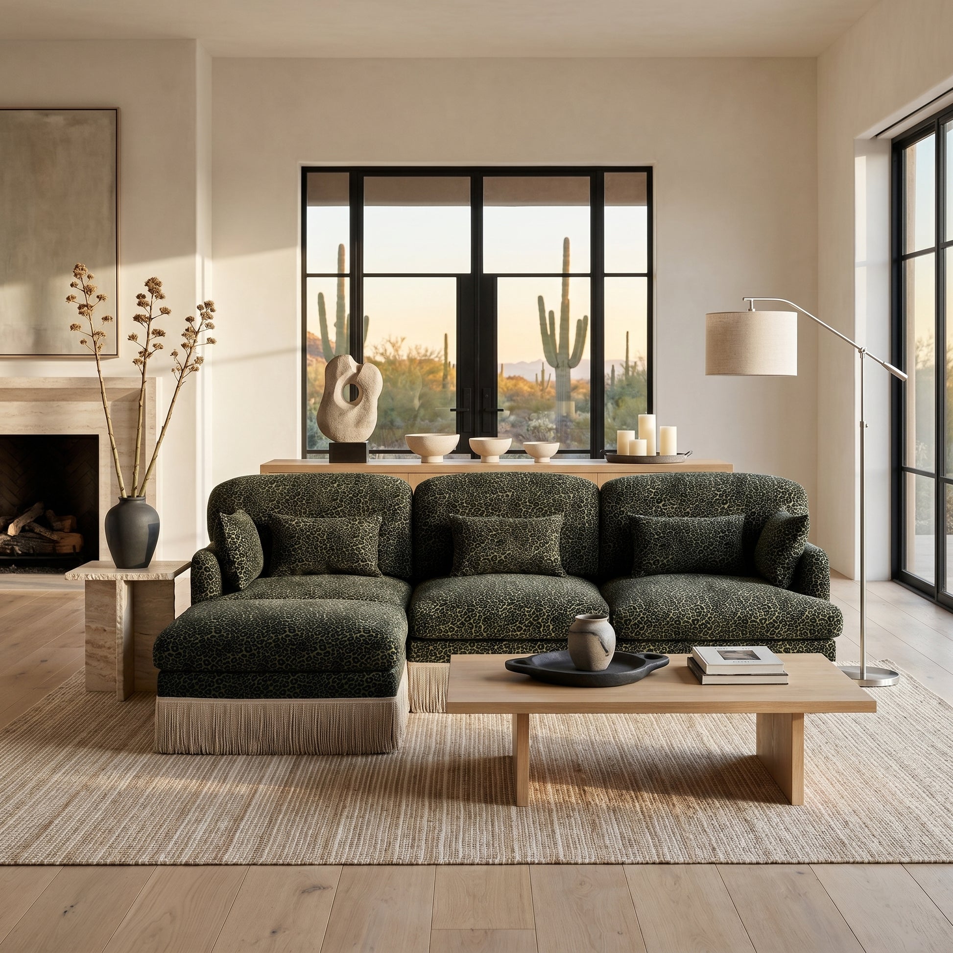 Tucson green leopard print chenille sectional sofa with fringe trim beside fireplace