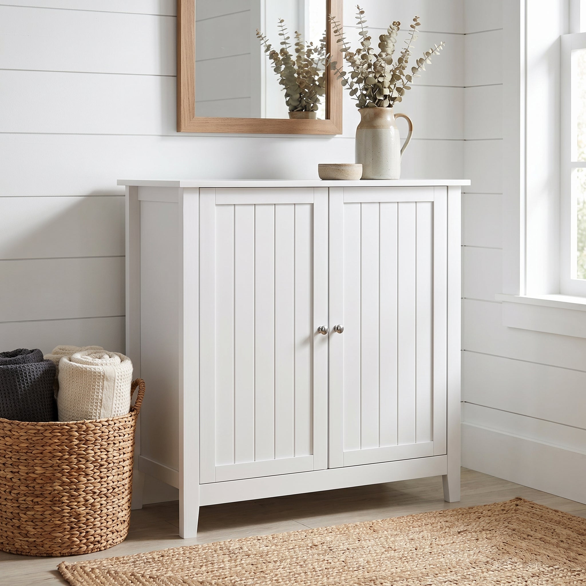 Tudor white storage cabinet showing a farmhouse room scene with double doors