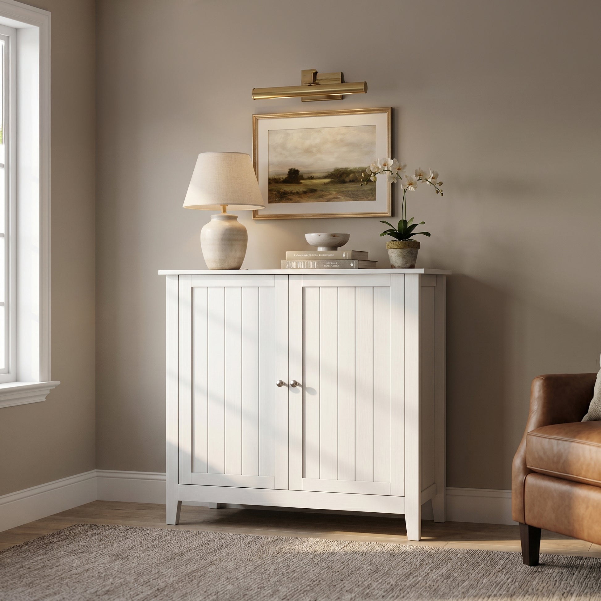 Tudor white storage cabinet showing a warm interior scene with framed wall art