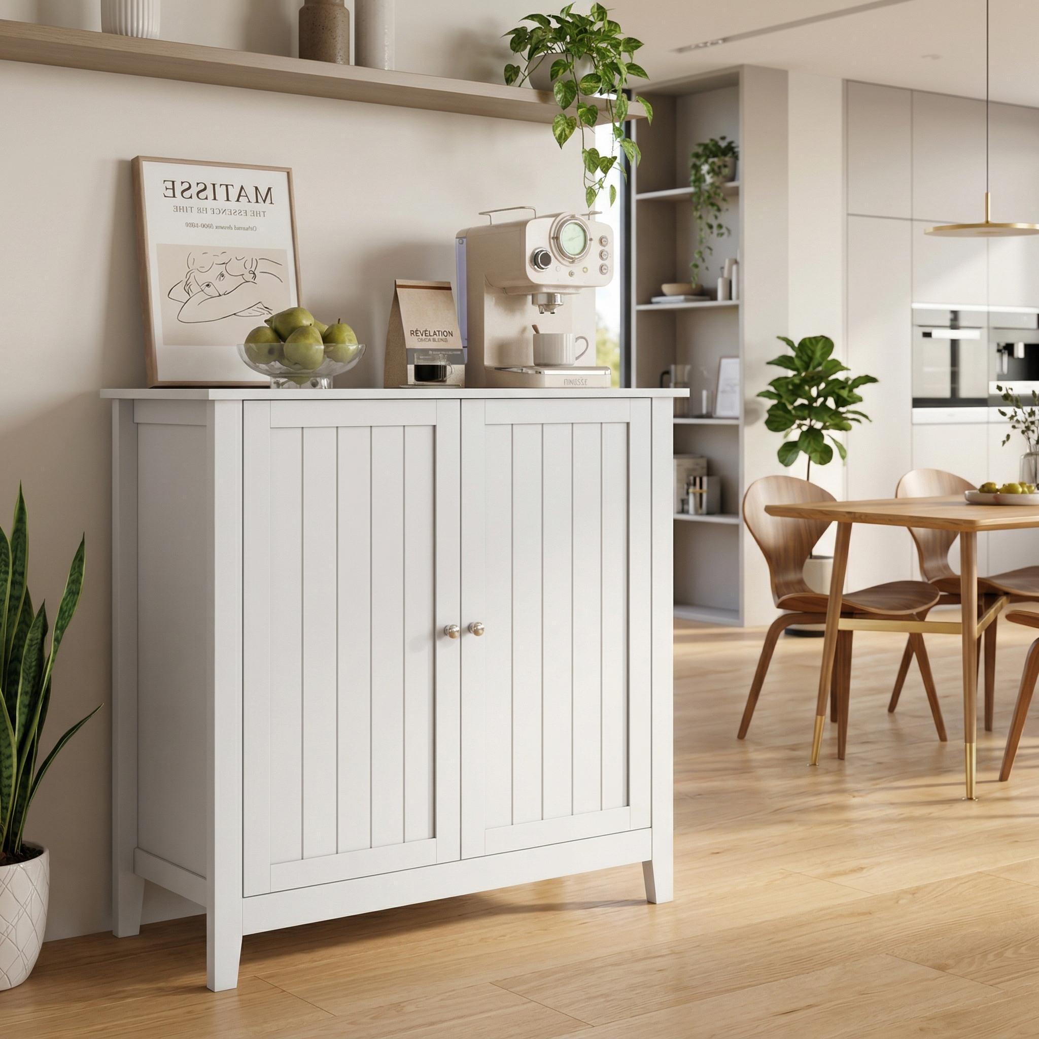 Tudor white storage cabinet showing a modern home setting with decorative display