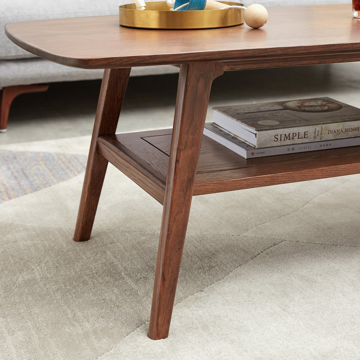 Tuscany walnut coffee table showing open storage shelf and tapered leg detail