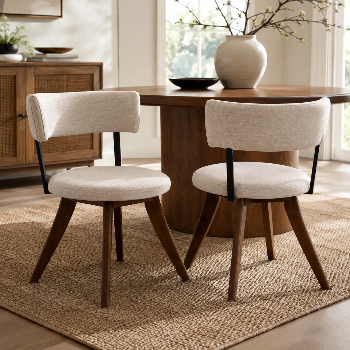 Vanern brown upholstered dining chairs beside a round wood table in a cozy dining space