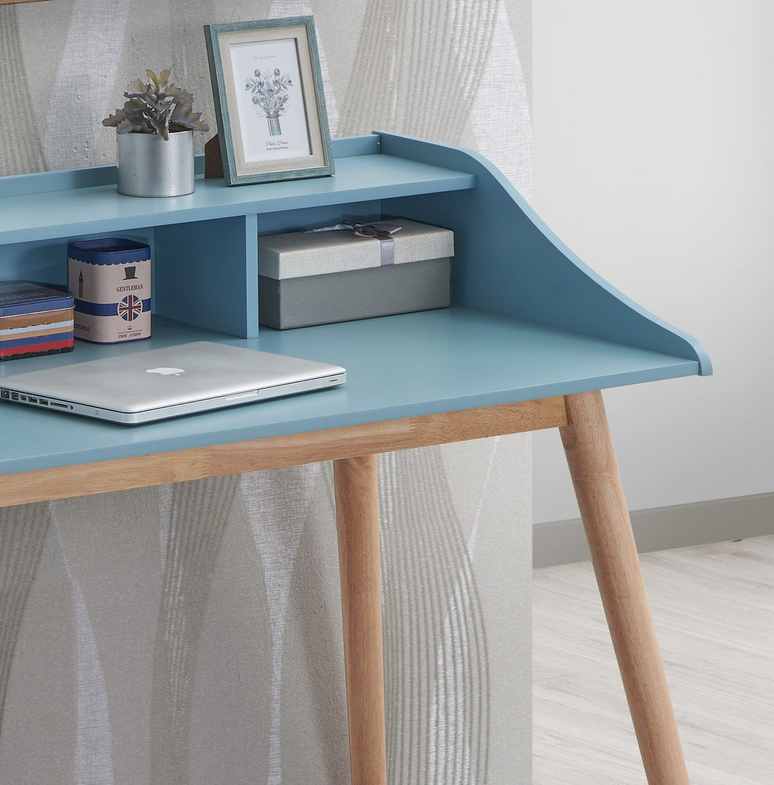 Vantaa blue writing desk showing desktop and open hutch storage detail