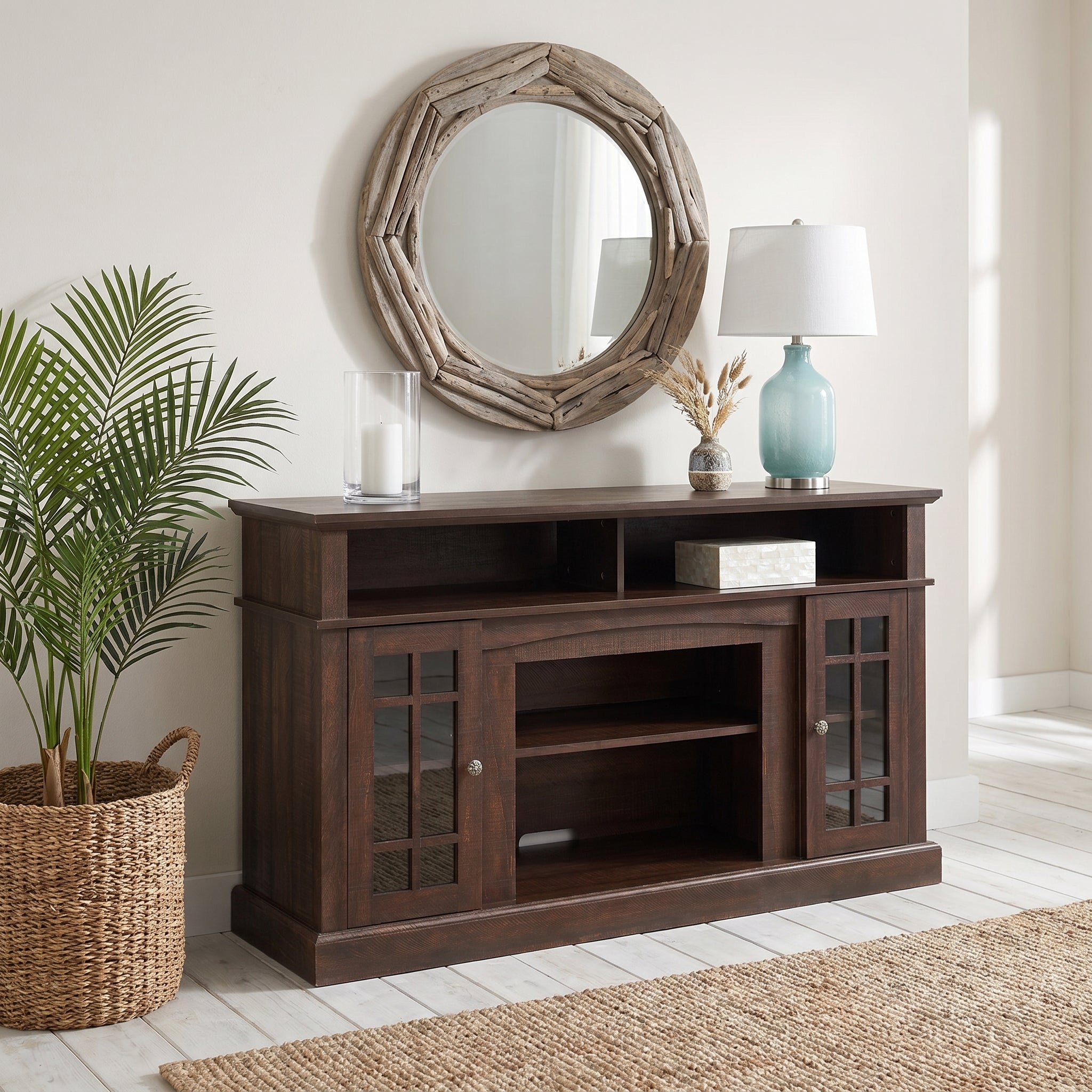 Victorian espresso tv stand showing a styled console setup with round wall mirror