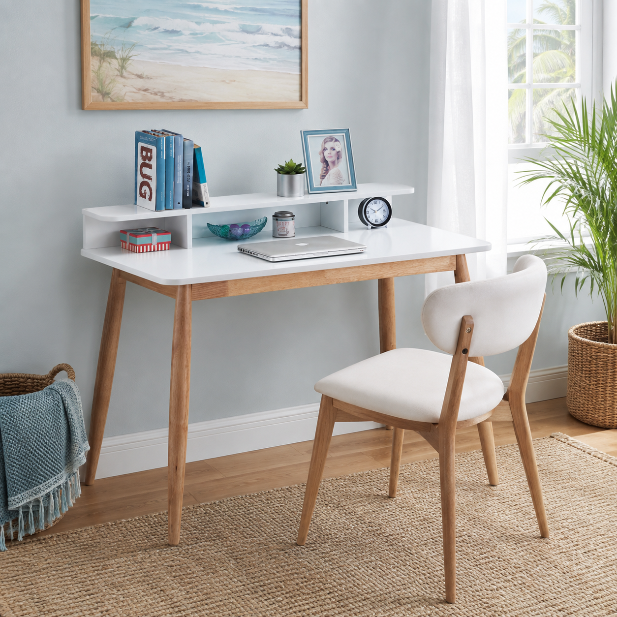 Visby white writing desk showing an open hutch with books and decor beside a large window