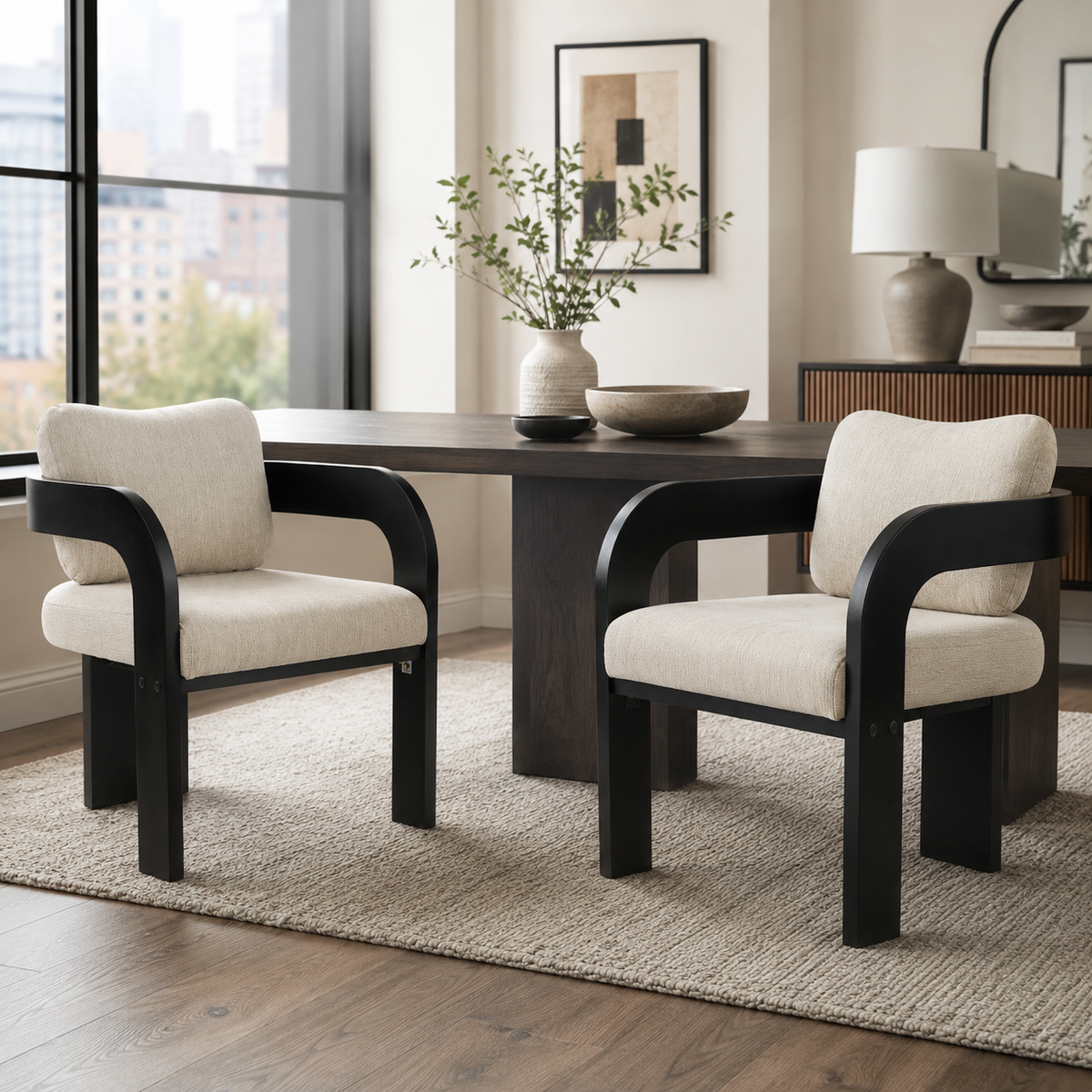 Wakatipu black upholstered dining armchairs around a rectangular dining table in a warm dining space