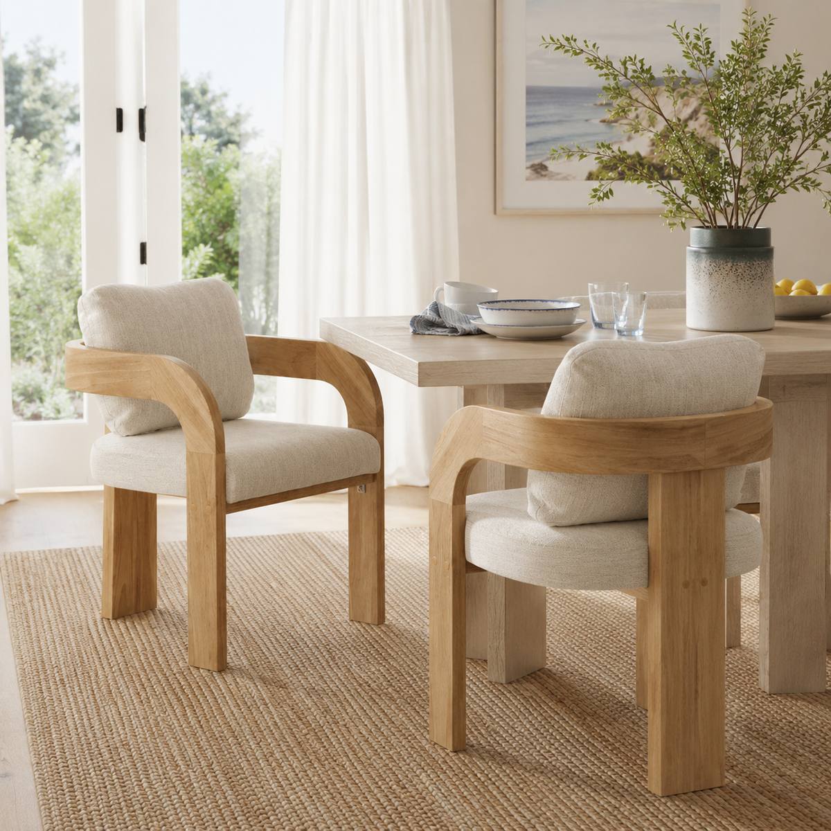 Wakatipu natural dining armchairs in a bright dining room with a wood table and neutral decor