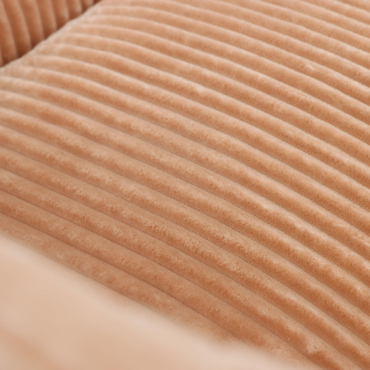 Westwood pink bean bag armchair showing corduroy upholstery texture detail