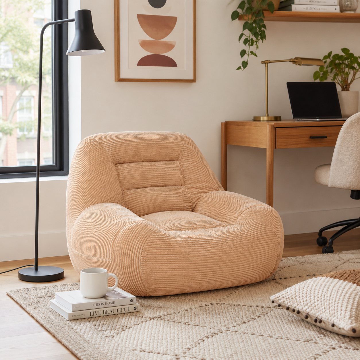 Westwood pink bean bag armchair shown in a bright living room with framed wall art and greenery
