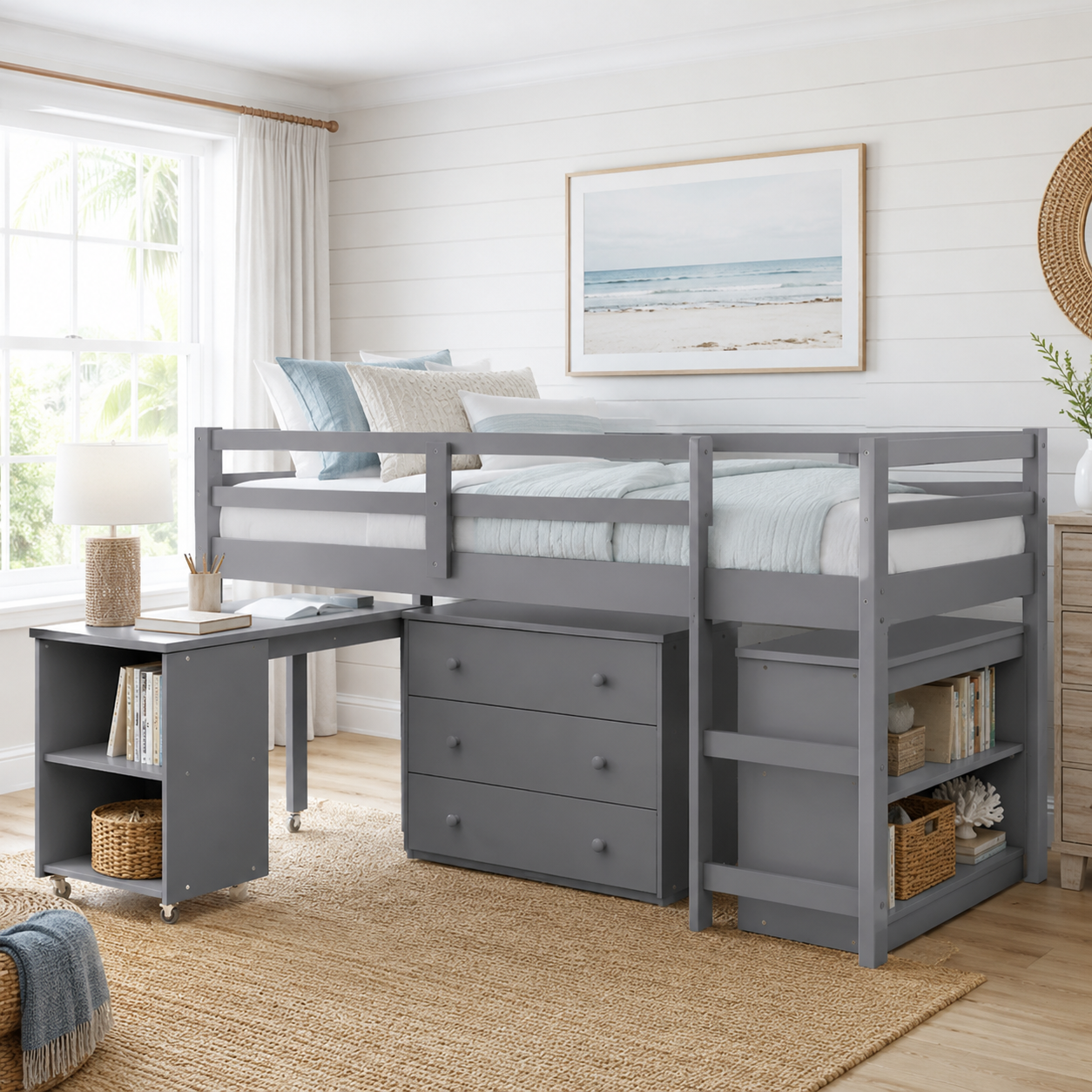 Ylven gray twin size low loft bed with rolling desk and storage chest in a bright bedroom